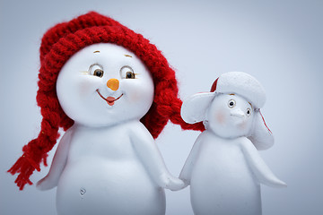 Image showing Cheerful snowman and penguin