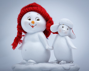 Image showing Cheerful snowman and penguin