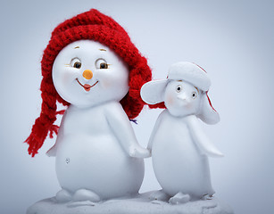 Image showing Cheerful snowman and penguin