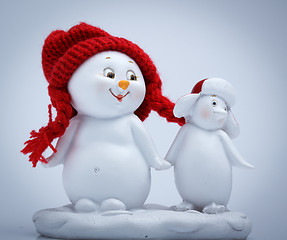 Image showing Cheerful snowman and penguin