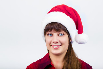 Image showing blue-eyed beautiful girl in santa hat