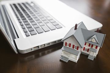 Image showing Miniature House And Laptop Computer