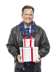 Image showing Man Wearing Black Leather Jacket Holding Christmas Gifts on Whit