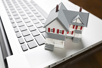 Image showing Miniature House on Laptop Computer