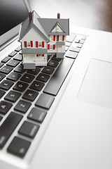 Image showing Miniature House on Laptop Computer