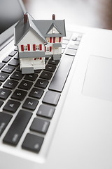 Image showing Miniature House on Laptop Computer