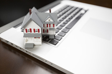 Image showing Miniature House on Laptop Computer