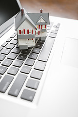 Image showing Miniature House on Laptop Computer