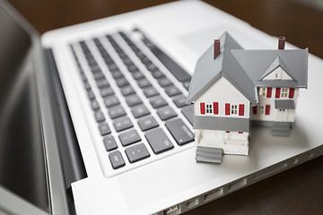 Image showing Miniature House on Laptop Computer