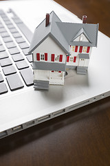 Image showing Miniature House on Laptop Computer