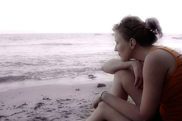 Image showing Woman sitting on the beach