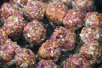 Image showing Close-up of meatballs cooking