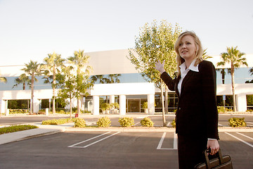 Image showing Real Estate Agent showing an office building