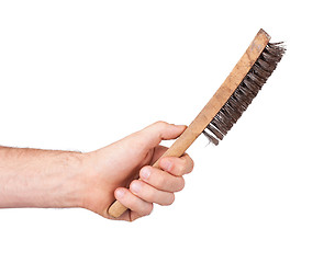 Image showing Isolated steel brush in male hand