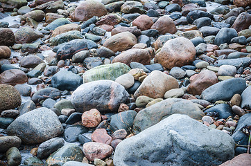 Image showing The freezed stones on coast of Baltic sea. A winter landscape