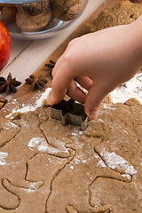 Image showing Close up little hands making the gingerbread cookies