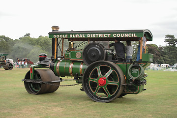 Image showing large green traction steam roller