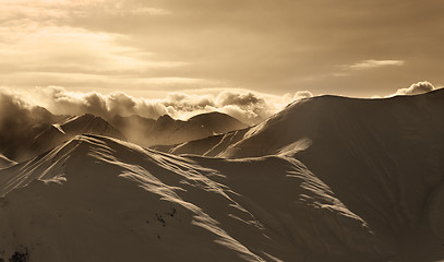 Image showing Sepia mountains in mist at sun evening