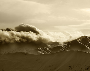 Image showing Sepia mountains in haze at sunny evening