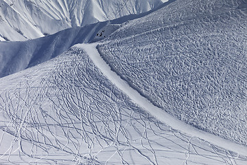 Image showing Off-piste slope and road with trace from ski and snowboards