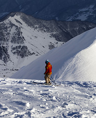 Image showing Skier on off-piste slope in sun evening