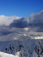 Image showing Snow mountains and blue sky with clouds