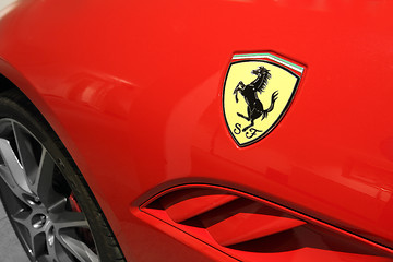 Image showing Ferrari Horse Logo Close Up on Red Car 