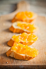 Image showing pieces of baguette with orange marmalade