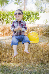 Image showing Young Mixed Race Boy Laughing with Sunglasses and Hard Hat