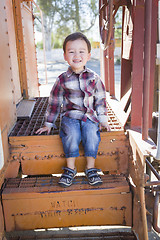 Image showing Cute Young Mixed Race Boy Having Fun on Railroad Car
