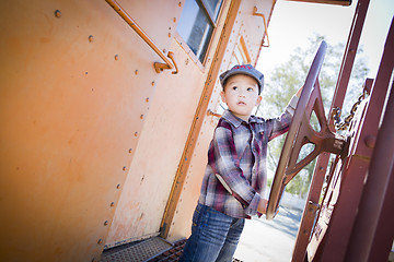 Image showing Cute Young Mixed Race Boy Having Fun on Railroad Car