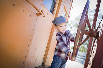 Image showing Cute Young Mixed Race Boy Having Fun on Railroad Car