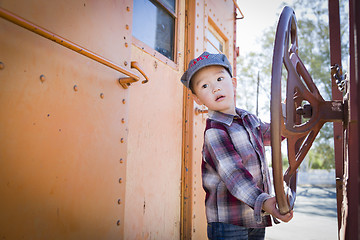 Image showing Cute Young Mixed Race Boy Having Fun on Railroad Car