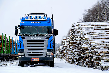 Image showing Blue Scania V8 Logging Truck at Snowy Railway Timber Yard