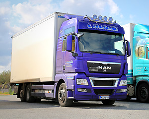 Image showing Purple Man Truck on a Yard