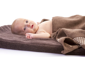 Image showing baby boy over brown blanket 