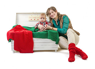 Image showing Baby boy in old box with his mother