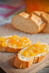 Image showing fresh bread with orange jam