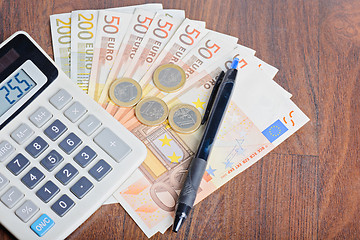 Image showing Calculator and money on the table