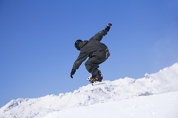 Image showing Extreme Snowboarder jumping