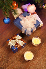 Image showing Christmas boxes with two candle