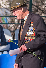 Image showing Elderly veteran of World War II near tribunes