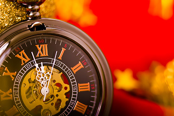 Image showing Christmas card. background with a clock and decorations. macro