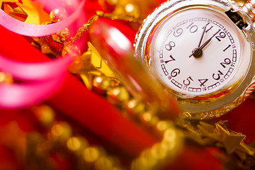 Image showing Christmas card. background with a clock and decorations. macro