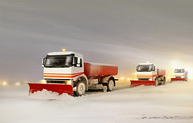 Image showing Snowplow Trucks Removing the Snow