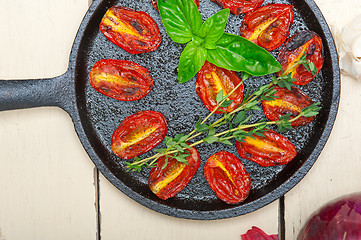 Image showing baked cherry tomatoes with basil and thyme