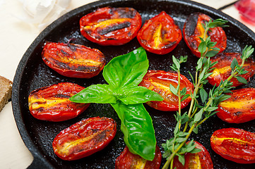 Image showing baked cherry tomatoes with basil and thyme