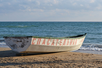 Image showing The white lifeboat on the bank of the Black Sea.