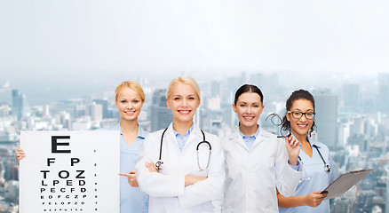 Image showing smiling female eye doctors and nurses