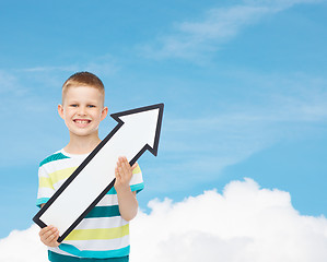 Image showing smiling little boy with blank arrow pointing right